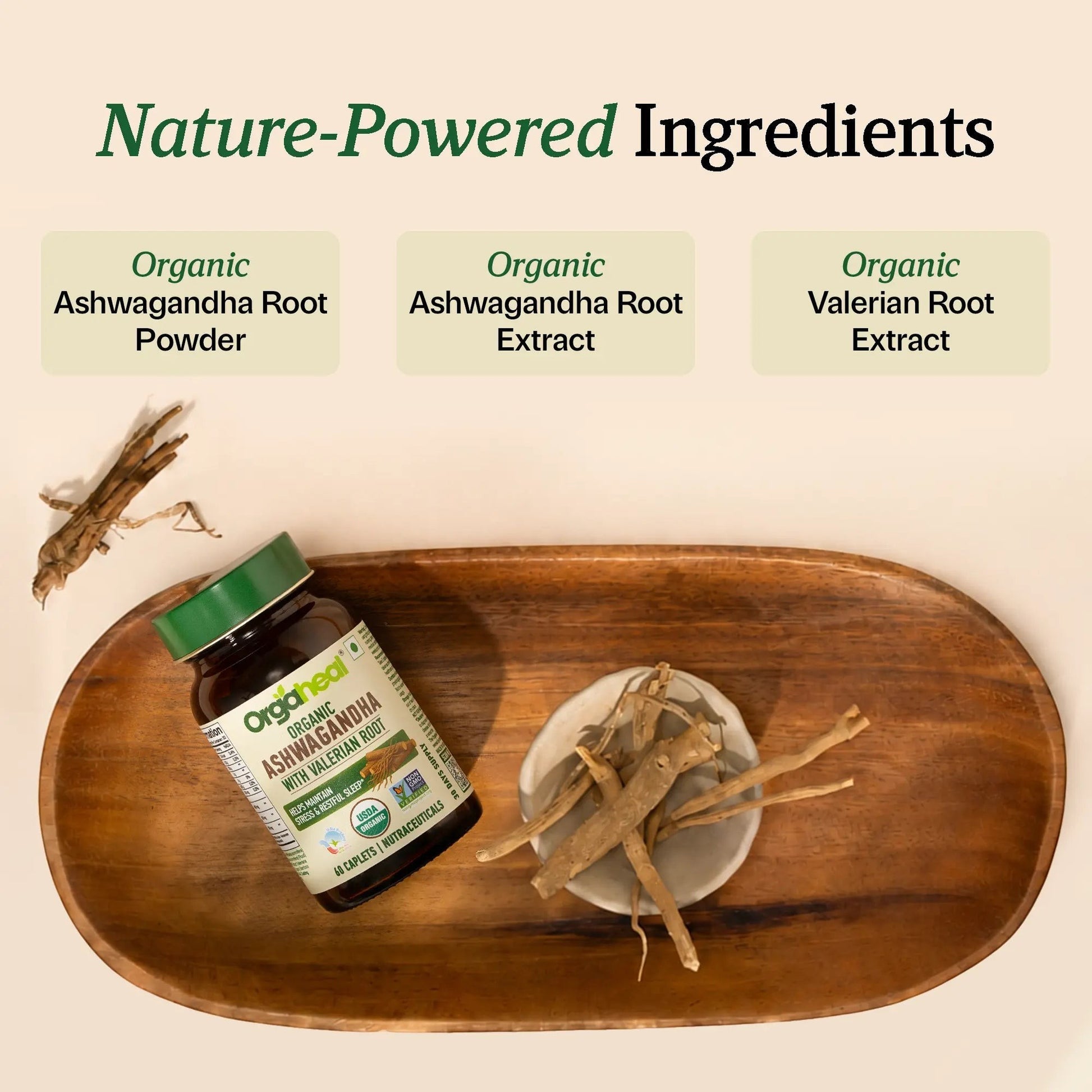 Orgaheal Organic Ashwagandha with Valerian Root caplets bottle on a wooden tray with dried roots.